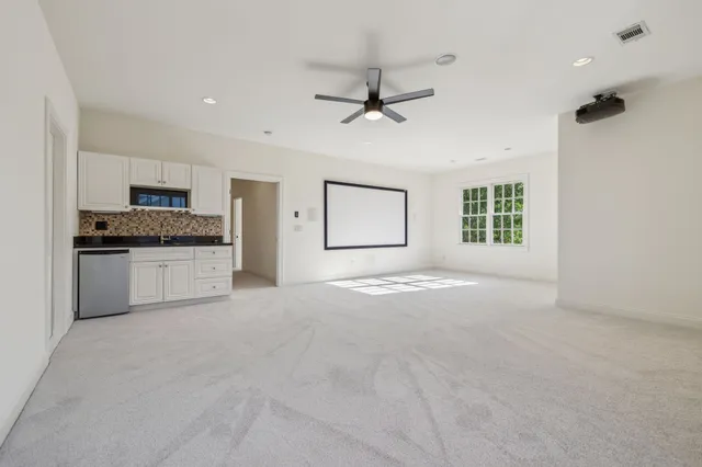 a view of a patio with a table and chairs