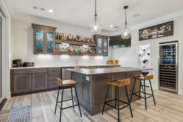 a view of living room filled with furniture and a large window