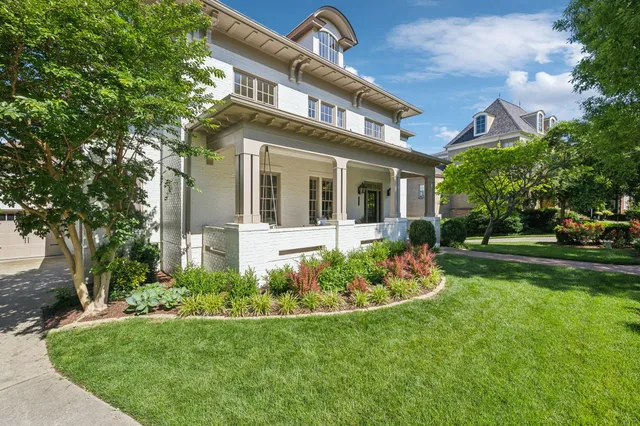 a living room with furniture chandelier and a table