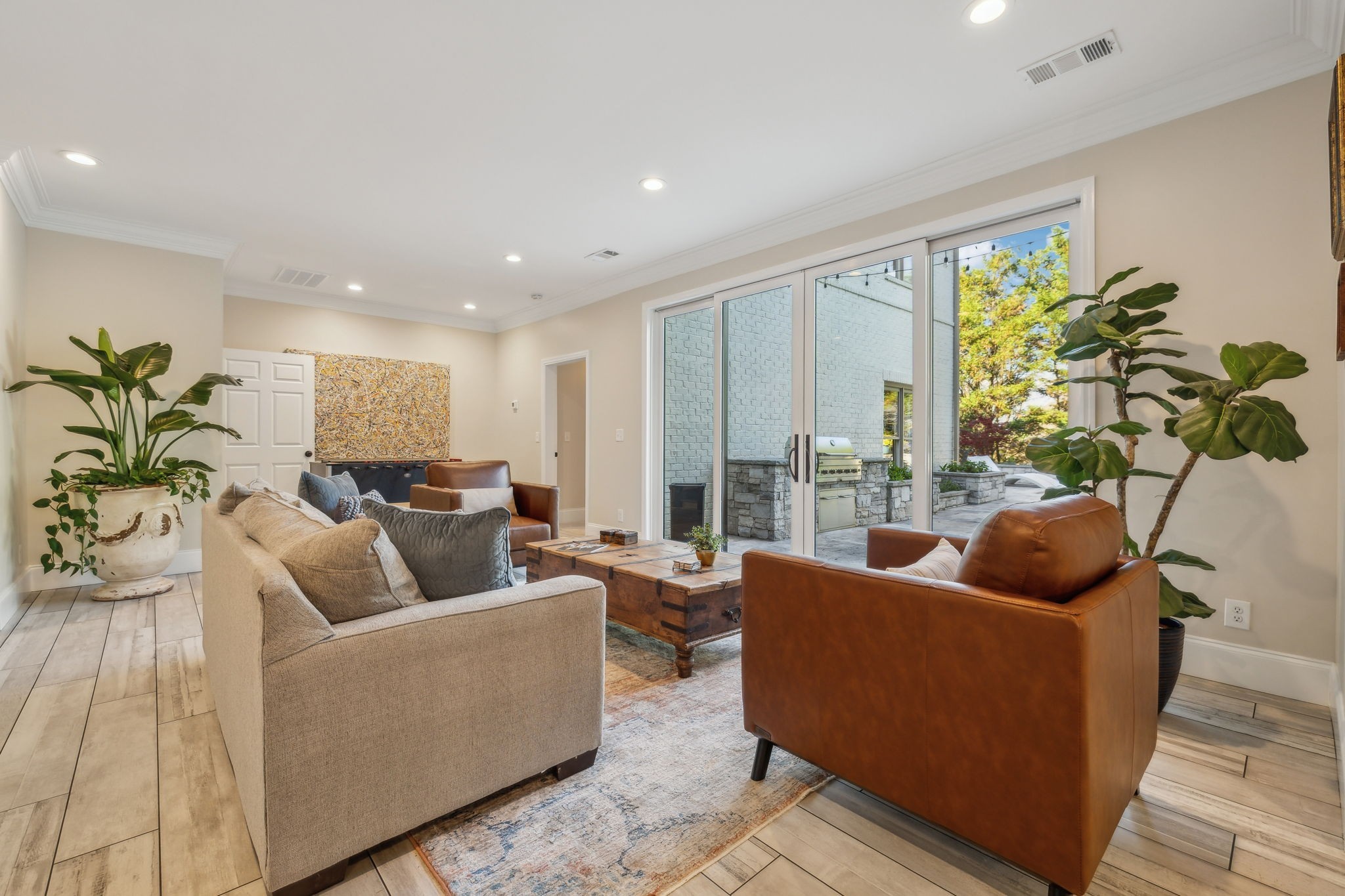424 Wild Elm Street Franklin, TN 37064 - Photo 55 of 100 a living room with furniture and a potted plant