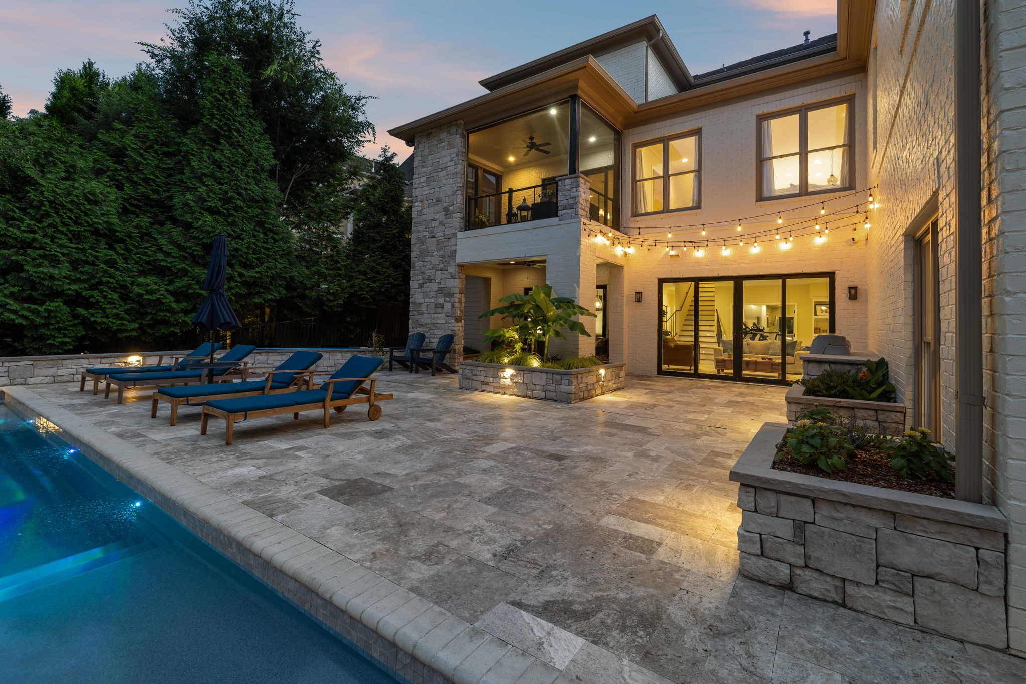 424 Wild Elm Street Franklin, TN 37064 - Photo 91 of 100 a backyard of a house with barbeque oven fire pit table and chairs
