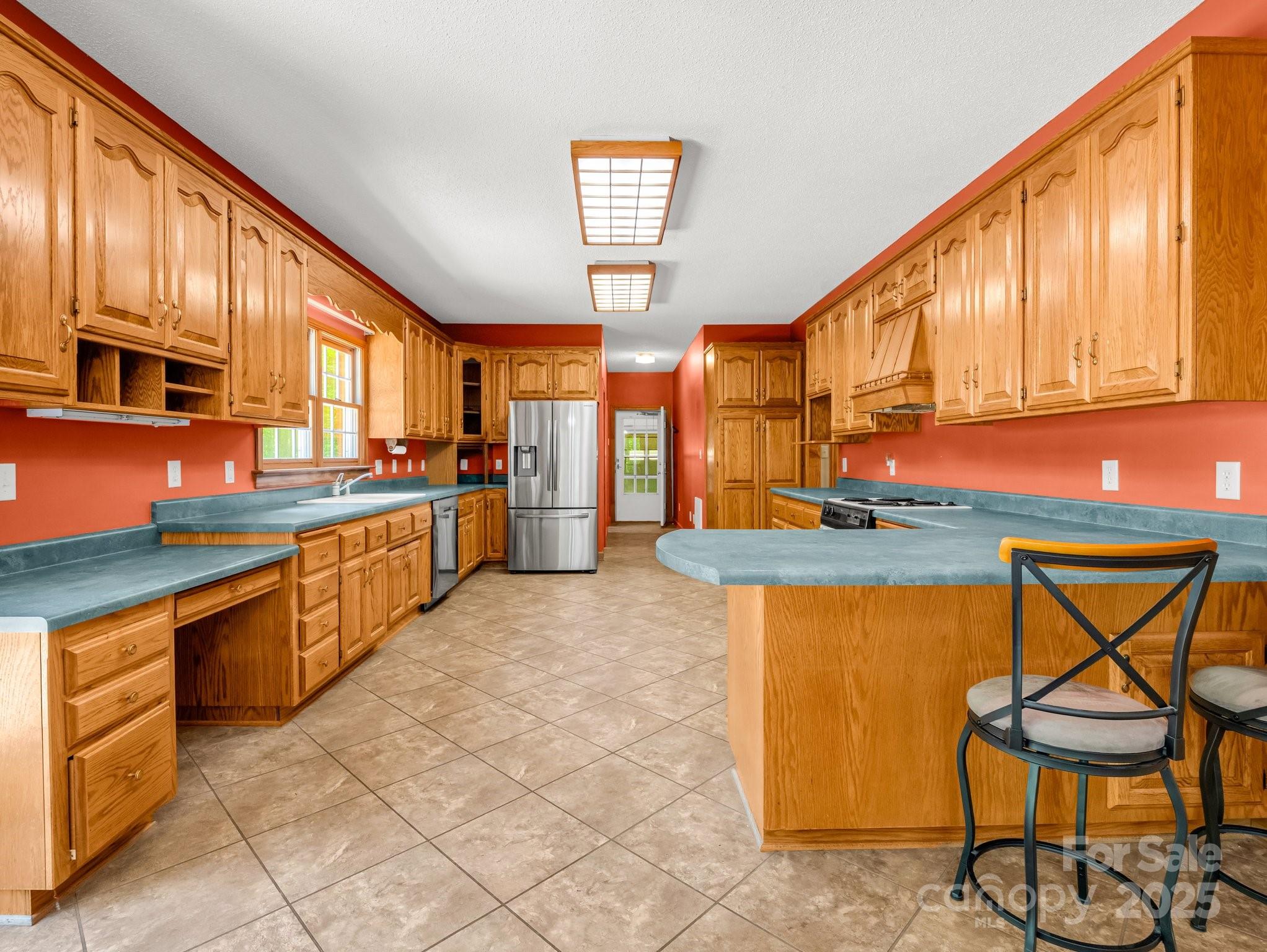 163 Summit Lane Rutherfordton, NC 28139 - Photo 11 of 44 a kitchen with stainless steel appliances granite countertop a stove a sink and a microwave