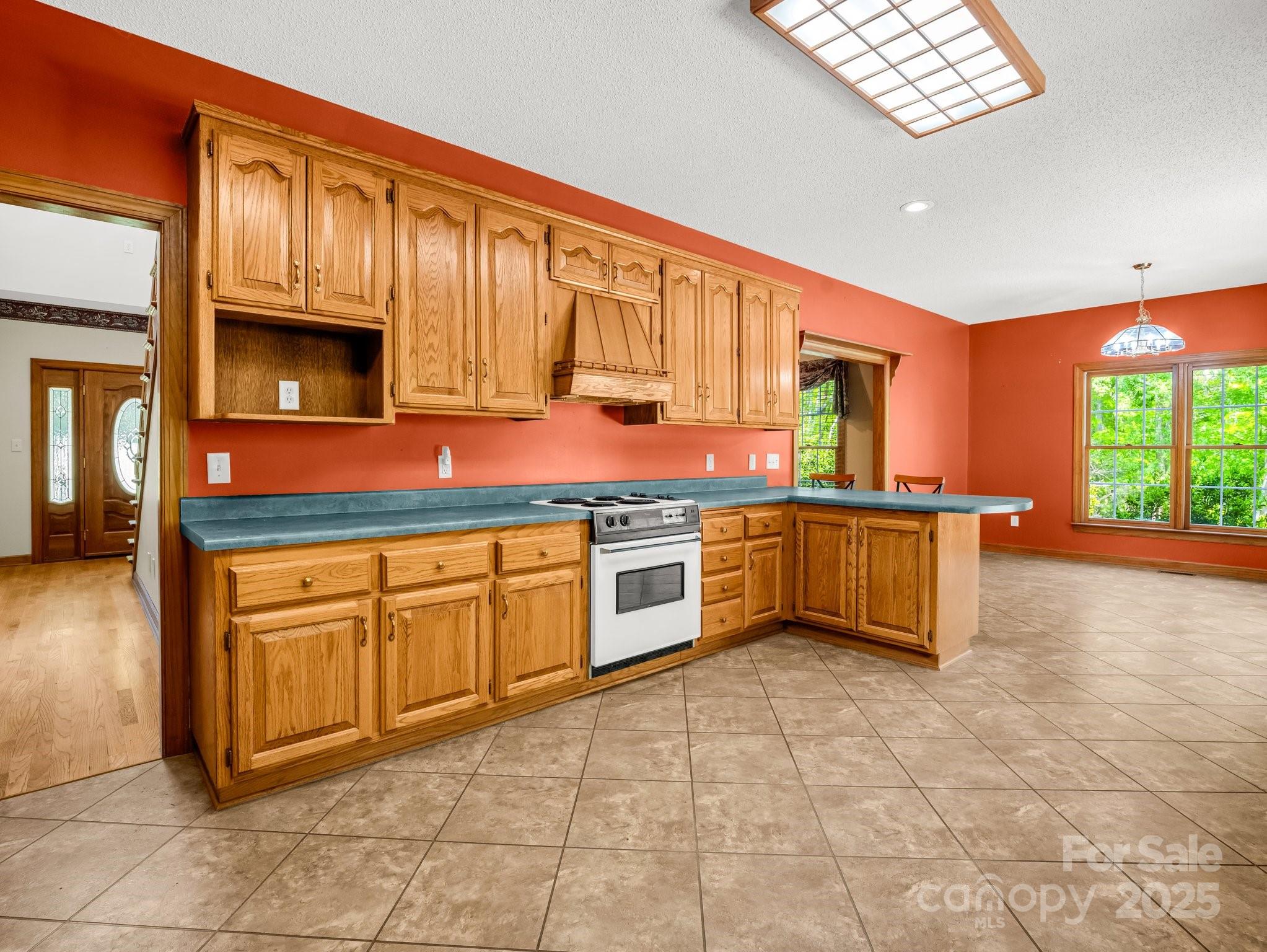 163 Summit Lane Rutherfordton, NC 28139 - Photo 13 of 44 a kitchen with stainless steel appliances granite countertop a stove a sink and a microwave