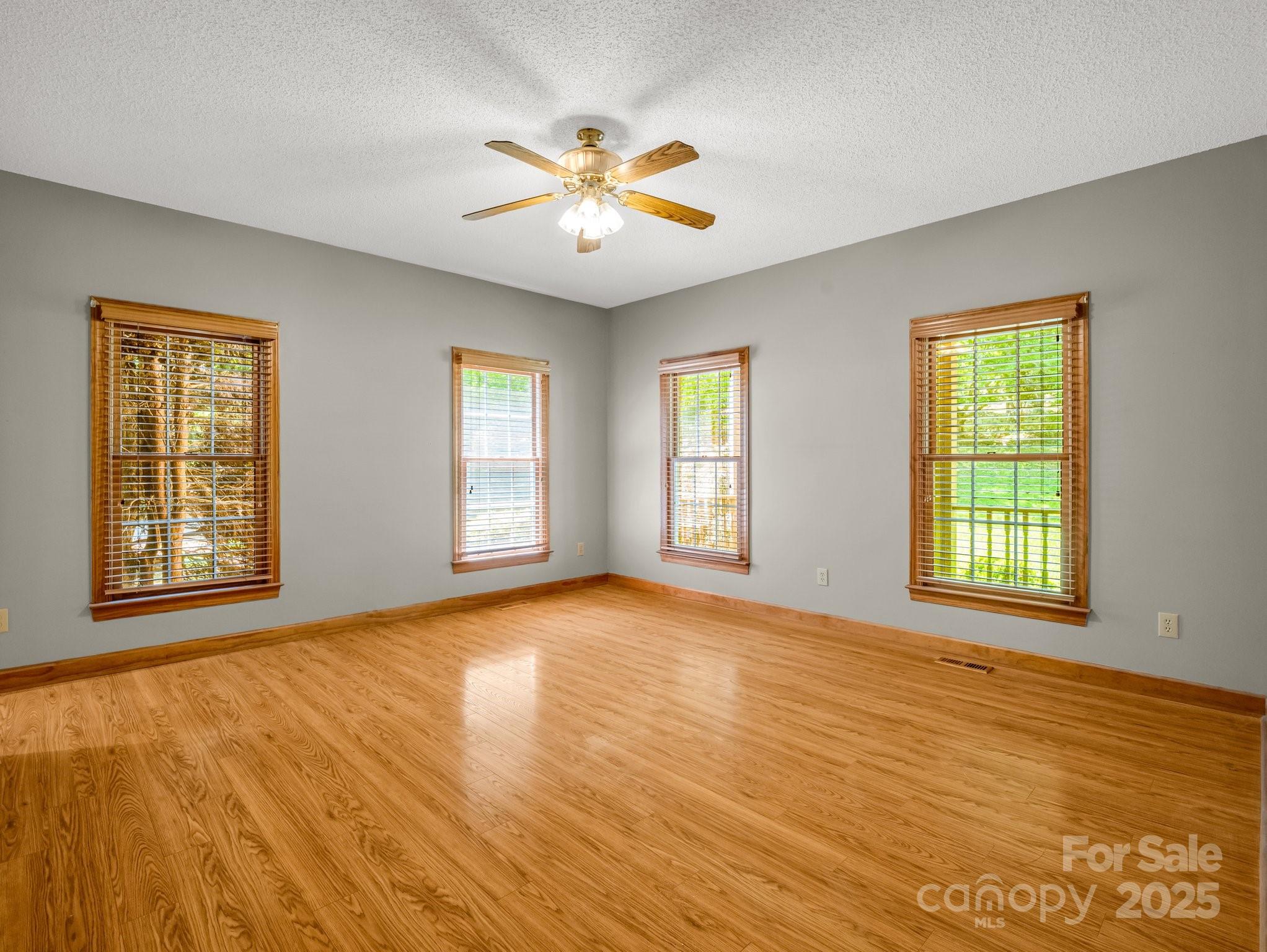 163 Summit Lane Rutherfordton, NC 28139 - Photo 16 of 44 a view of an empty room with window and wooden floor