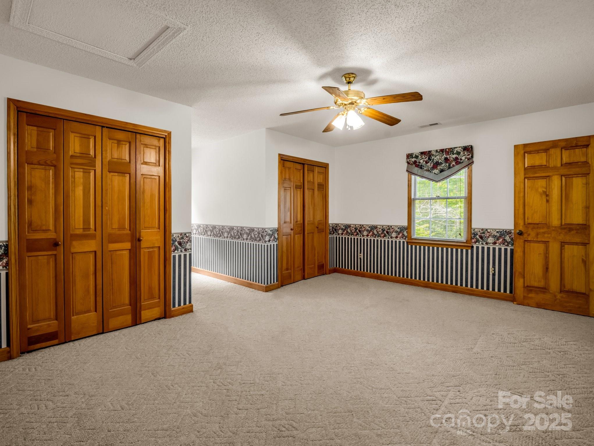 163 Summit Lane Rutherfordton, NC 28139 - Photo 23 of 44 a view of a room with a ceiling fan and windows