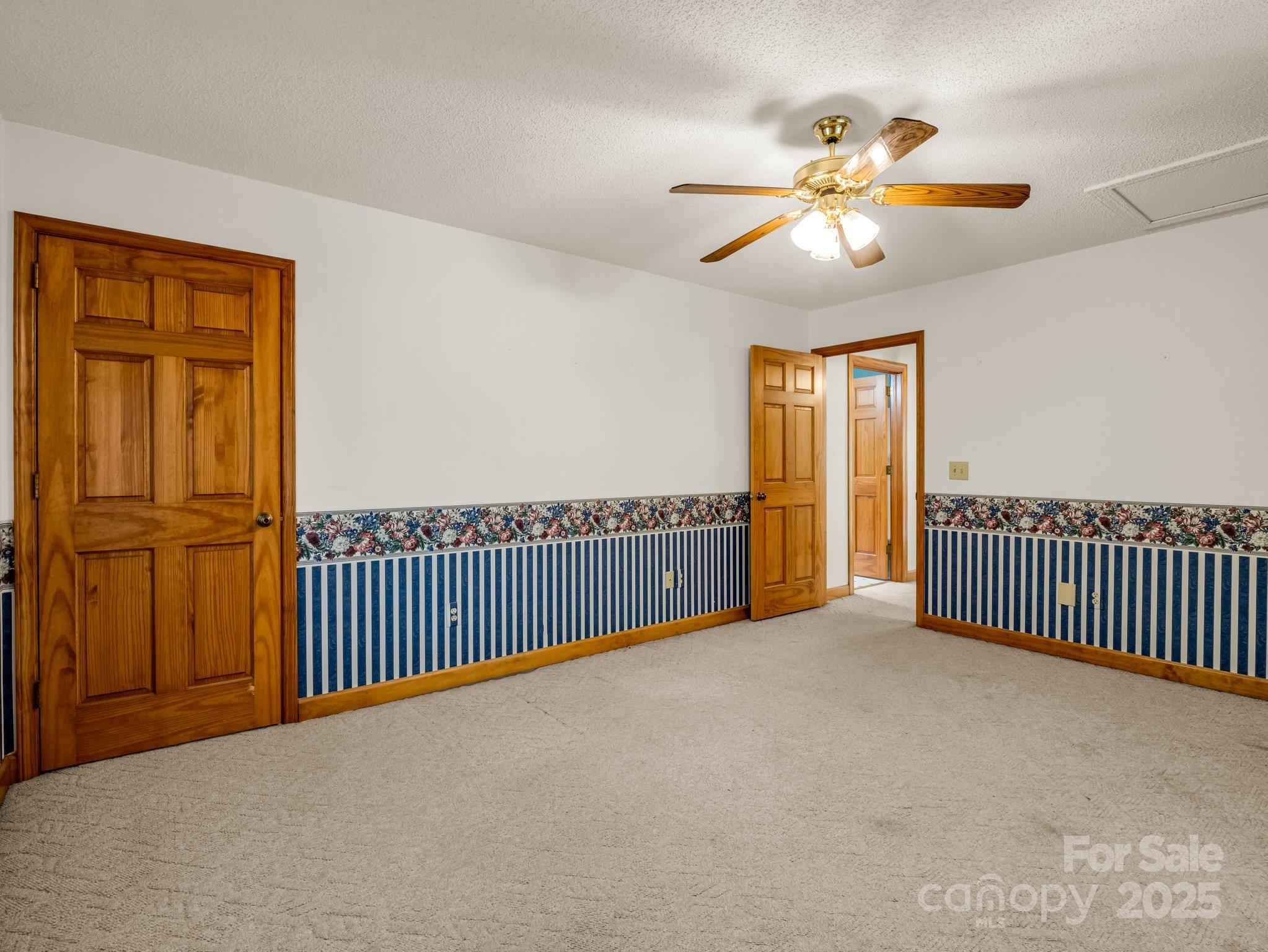 163 Summit Lane Rutherfordton, NC 28139 - Photo 24 of 44 a view of a room with wooden floor windows ceiling fan and a ceiling fan