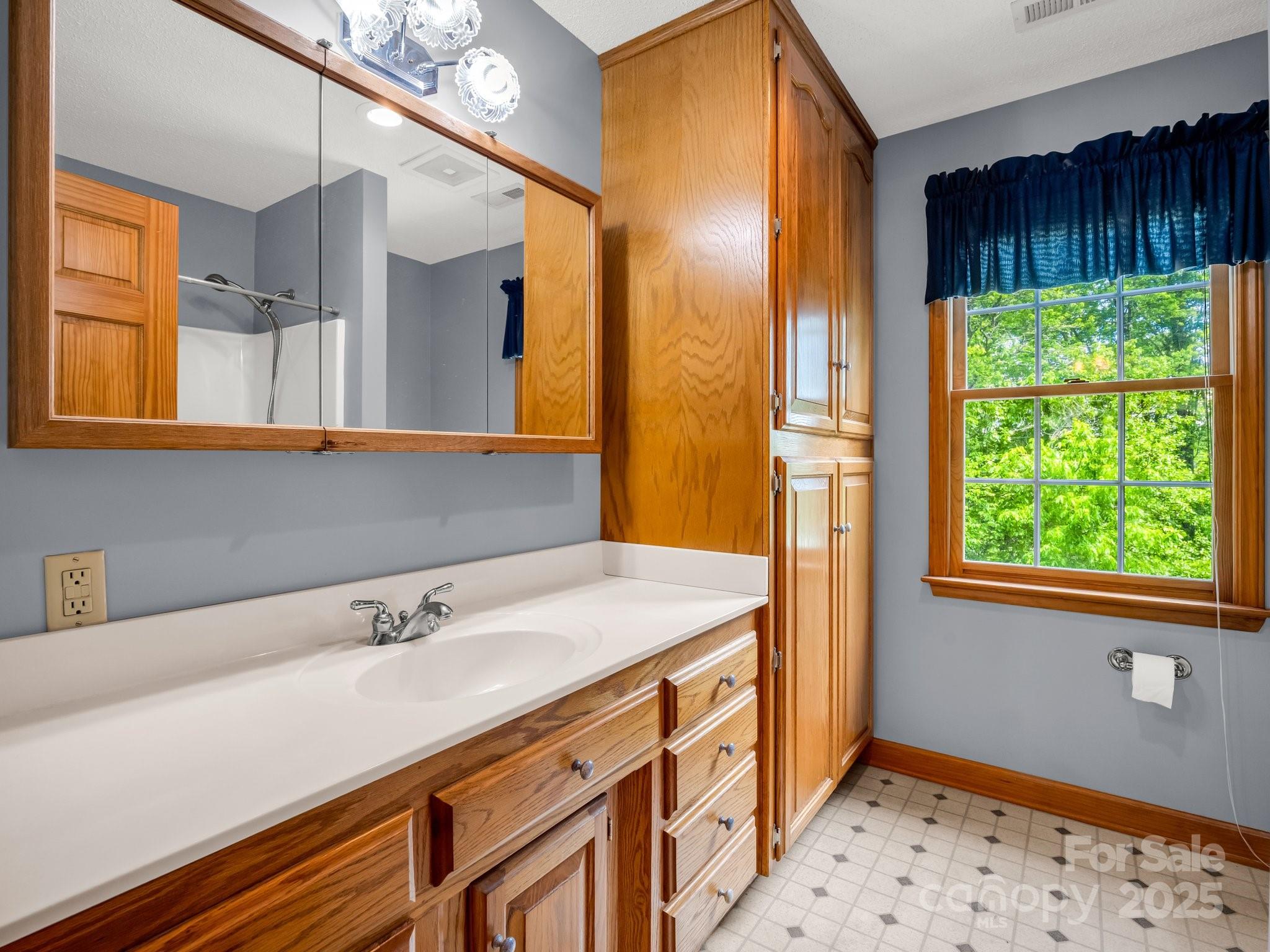 163 Summit Lane Rutherfordton, NC 28139 - Photo 25 of 44 a bathroom with a sink and a mirror
