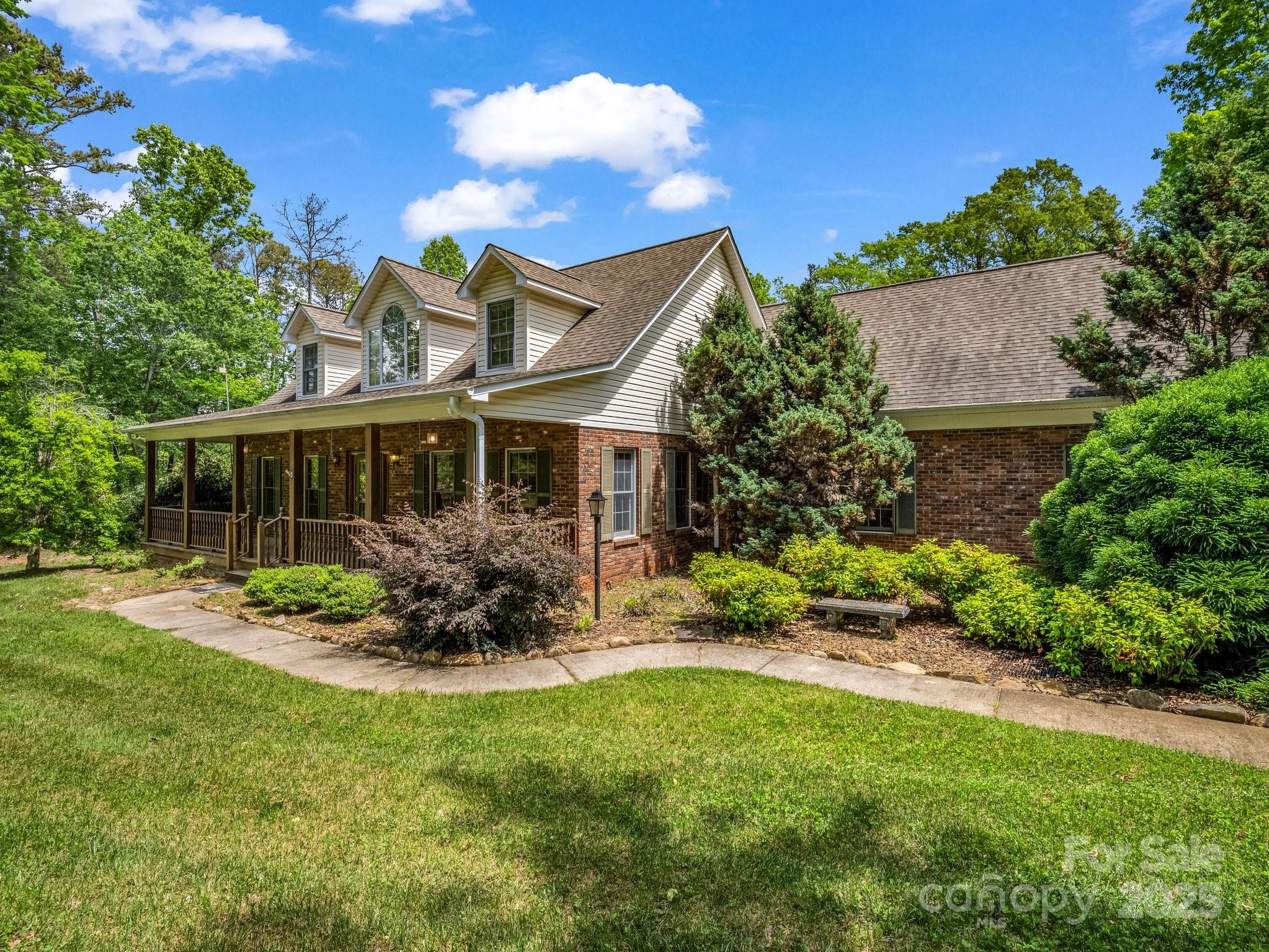 163 Summit Lane Rutherfordton, NC 28139 - Photo 4 of 44 a front view of a house with garden