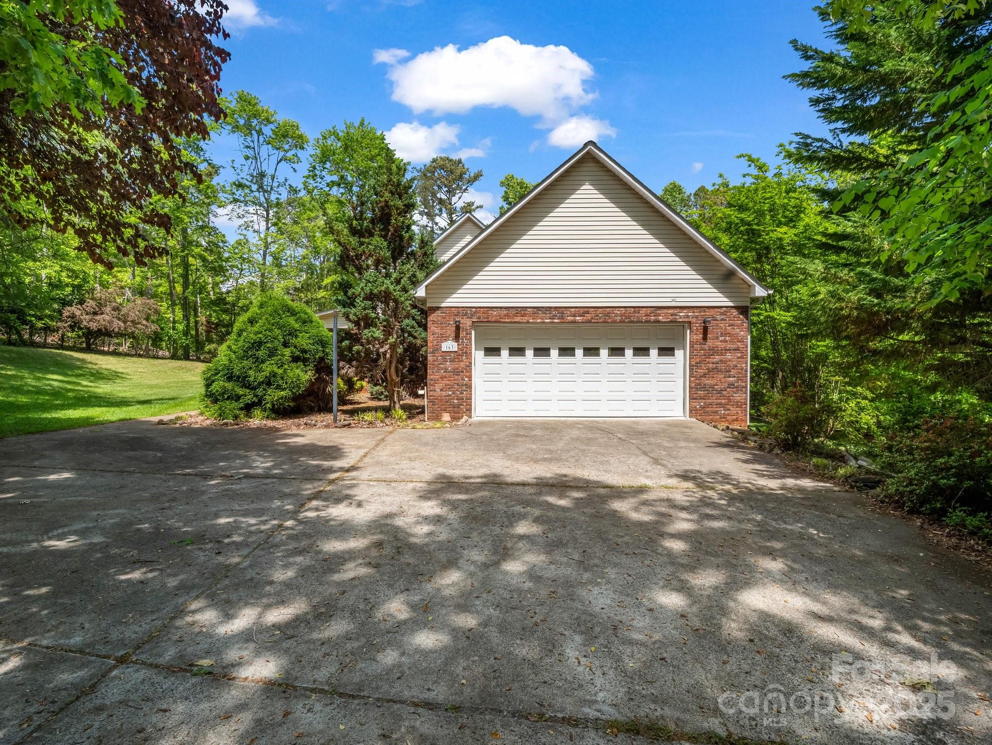 163 Summit Lane Rutherfordton, NC 28139 - Photo 5 of 44 a view of a house with a yard and a garage