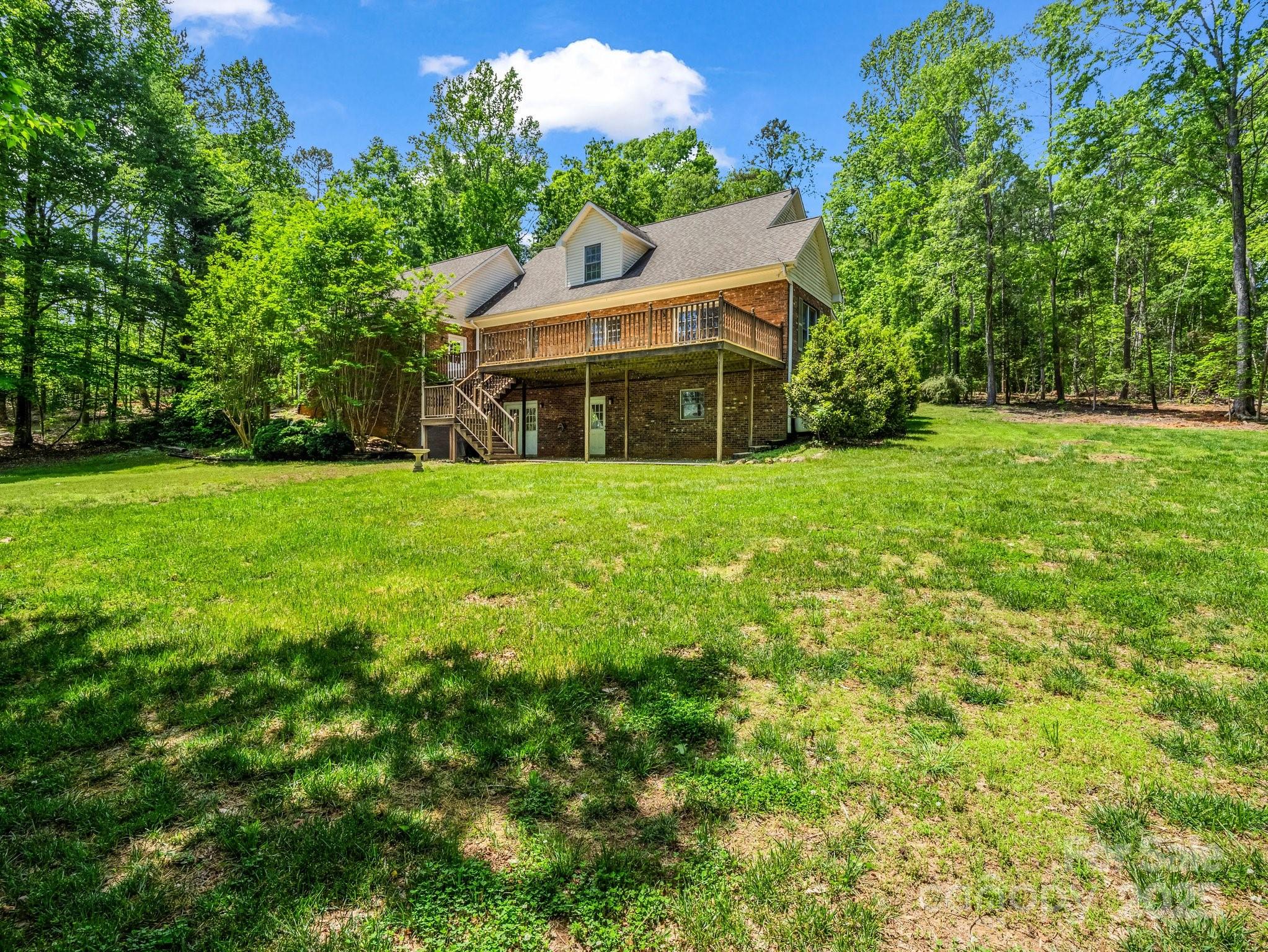 163 Summit Lane Rutherfordton, NC 28139 - Photo 7 of 44 a view of a house with a garden