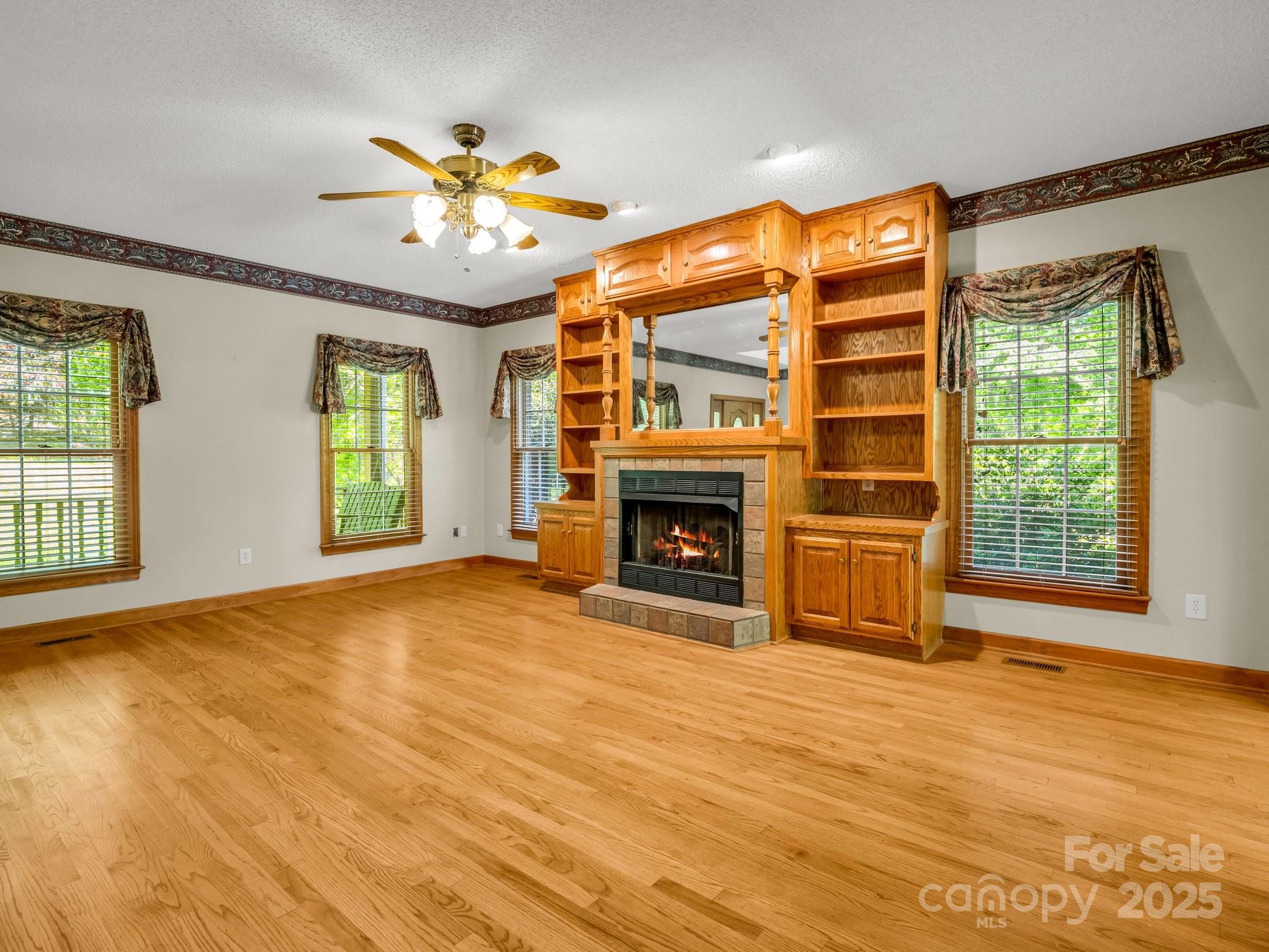163 Summit Lane Rutherfordton, NC 28139 - Photo 9 of 44 a view of an empty room with a fireplace and a window