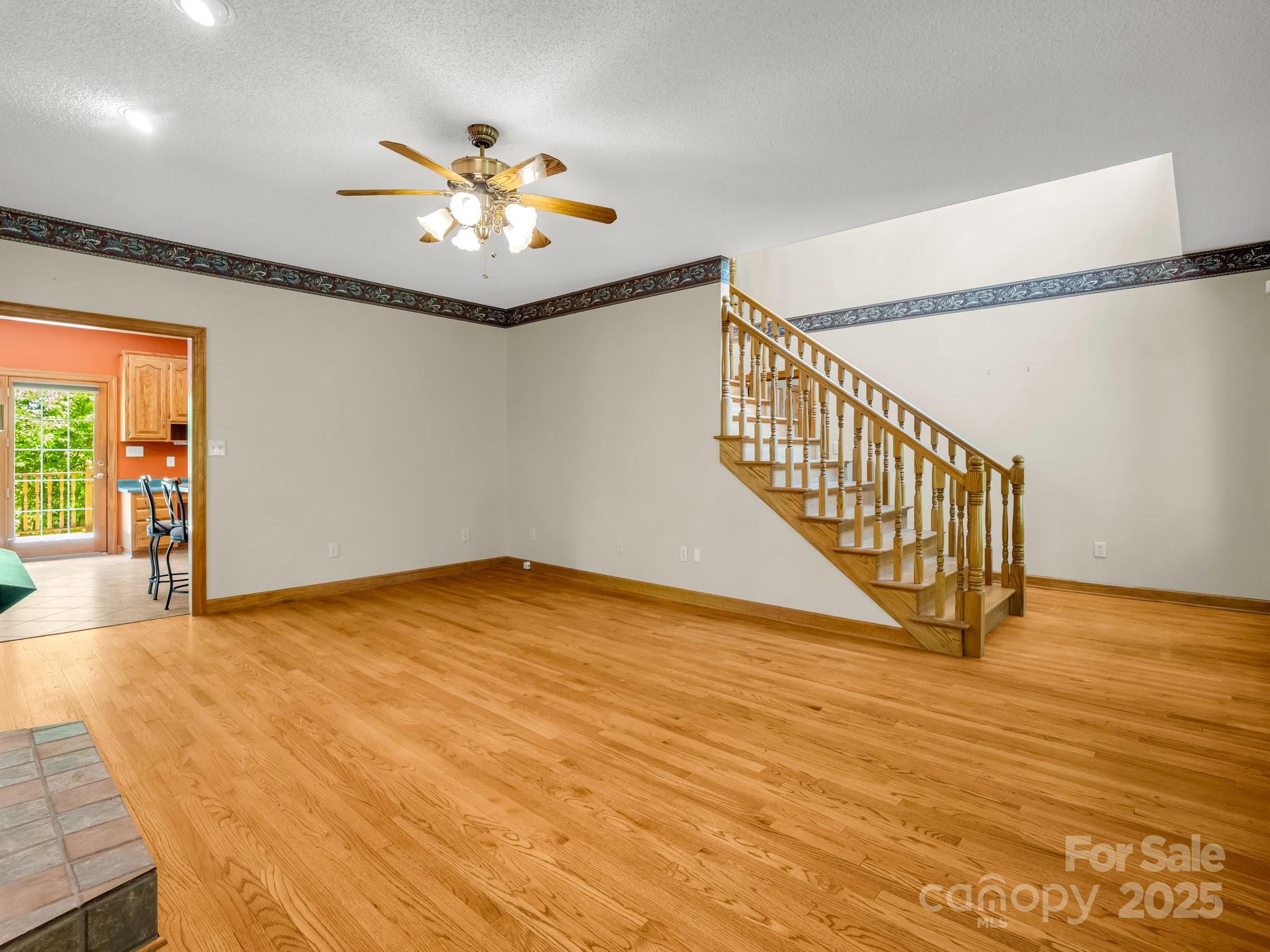 163 Summit Lane Rutherfordton, NC 28139 - Photo 10 of 44 a view of an empty room with window and a chandelier