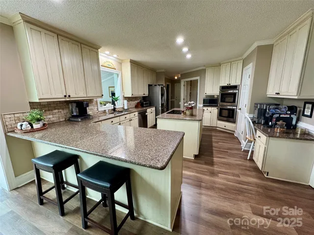 a view of kitchen dining table and chairs