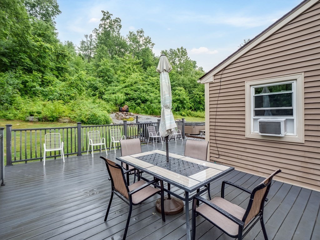 1850 North Brookfield Road Oakham, MA 01068 - Photo 7 of 42 a view of a patio with wooden floor
