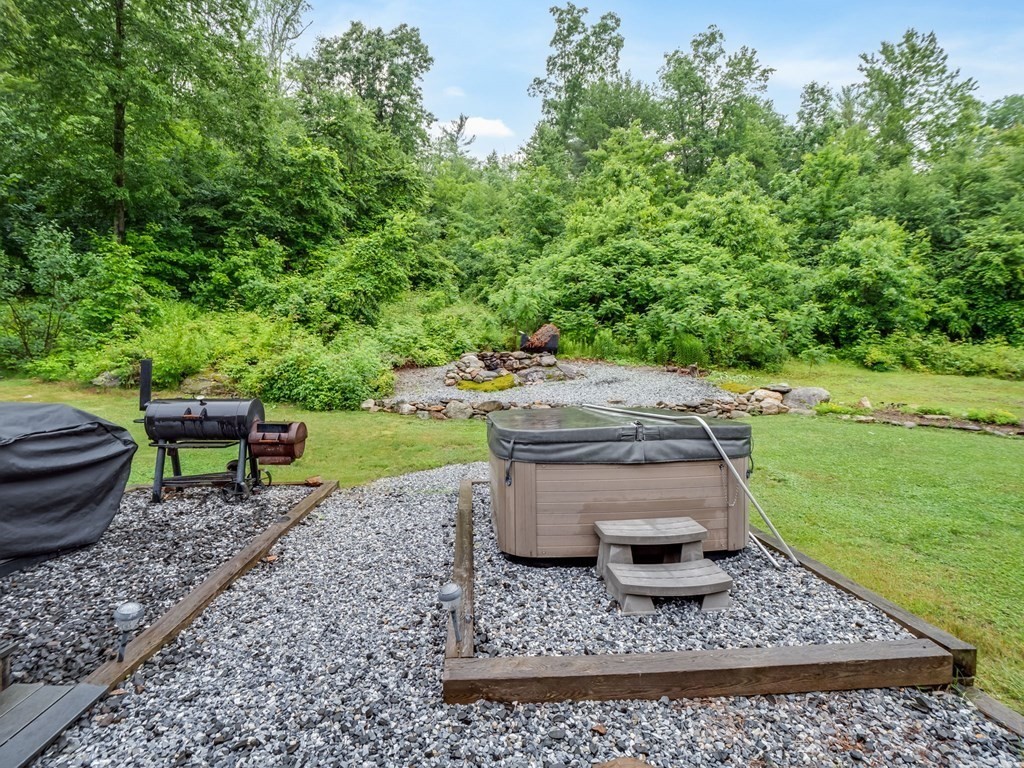 1850 North Brookfield Road Oakham, MA 01068 - Photo 8 of 42 a view of a backyard with wooden fence