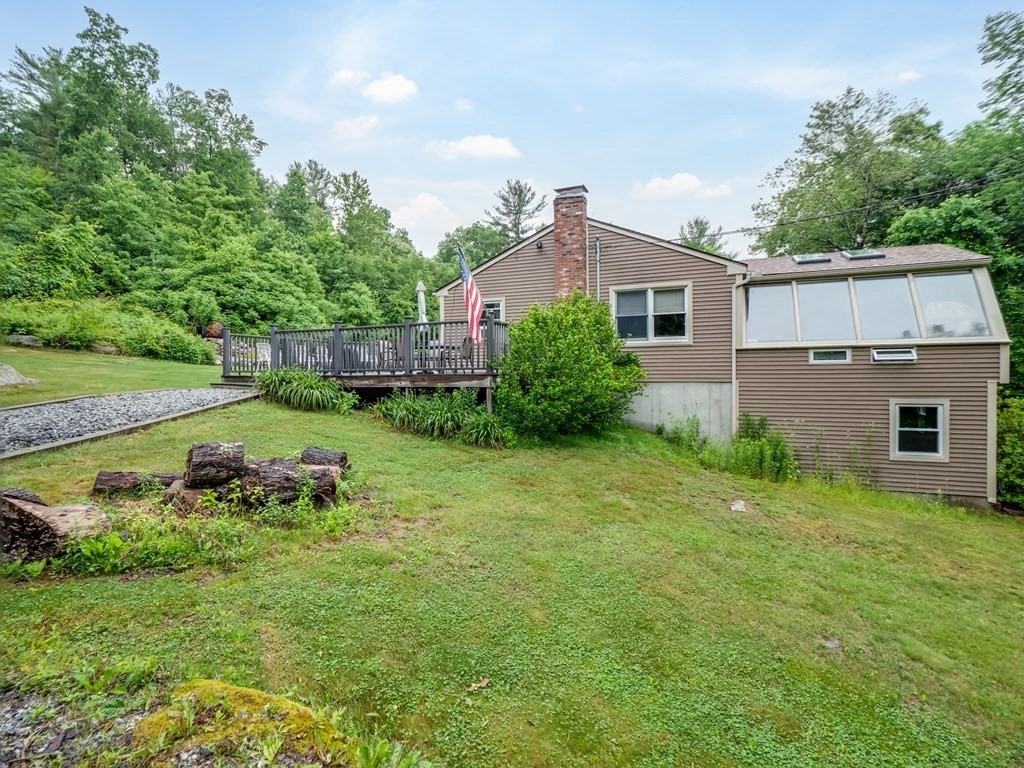 1850 North Brookfield Road Oakham, MA 01068 - Photo 10 of 42 a backyard of a house with lots of green space