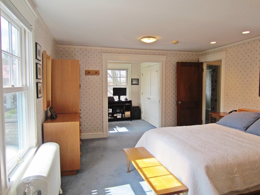 12 Arlington Road Wellesley, MA 02481 - Photo 17 of 26 a bedroom with a bed and a couch