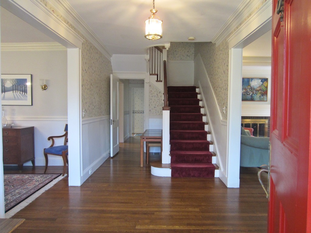 12 Arlington Road Wellesley, MA 02481 - Photo 4 of 26 a view of entryway and hall with wooden floor