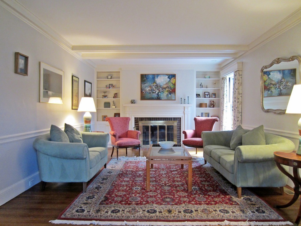 12 Arlington Road Wellesley, MA 02481 - Photo 6 of 26 a living room with furniture a rug and a fireplace