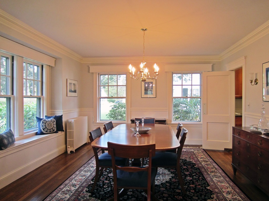 12 Arlington Road Wellesley, MA 02481 - Photo 7 of 26 a dining room with furniture a chandelier and wooden floor
