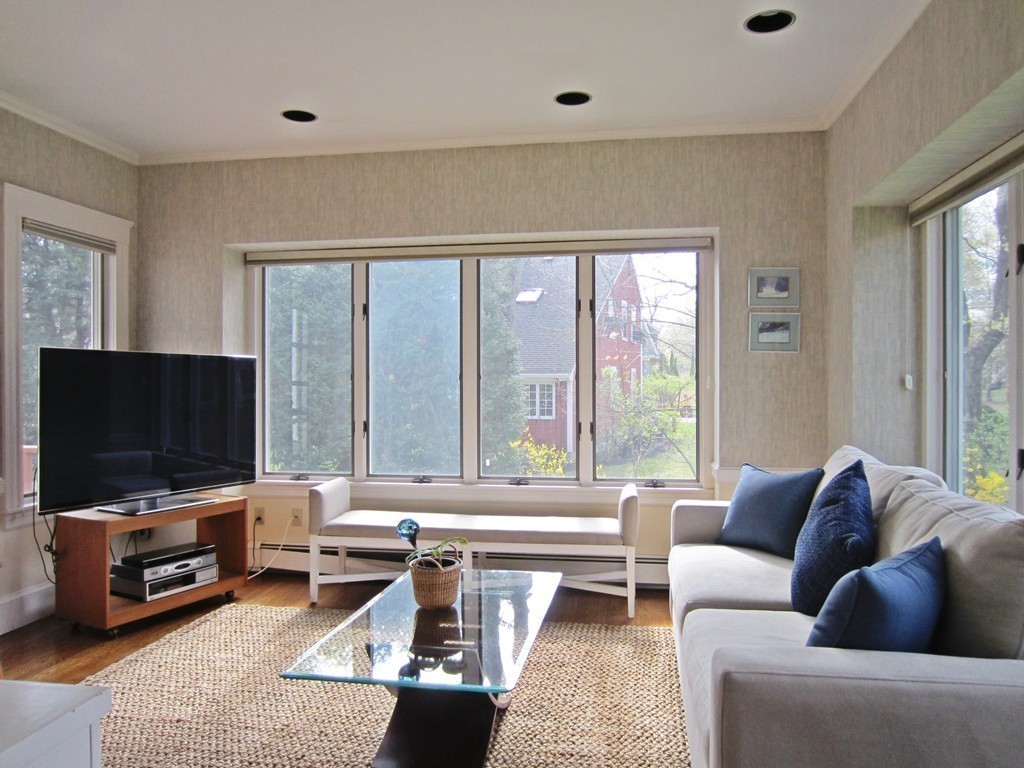 12 Arlington Road Wellesley, MA 02481 - Photo 9 of 26 a living room with furniture and a flat screen tv