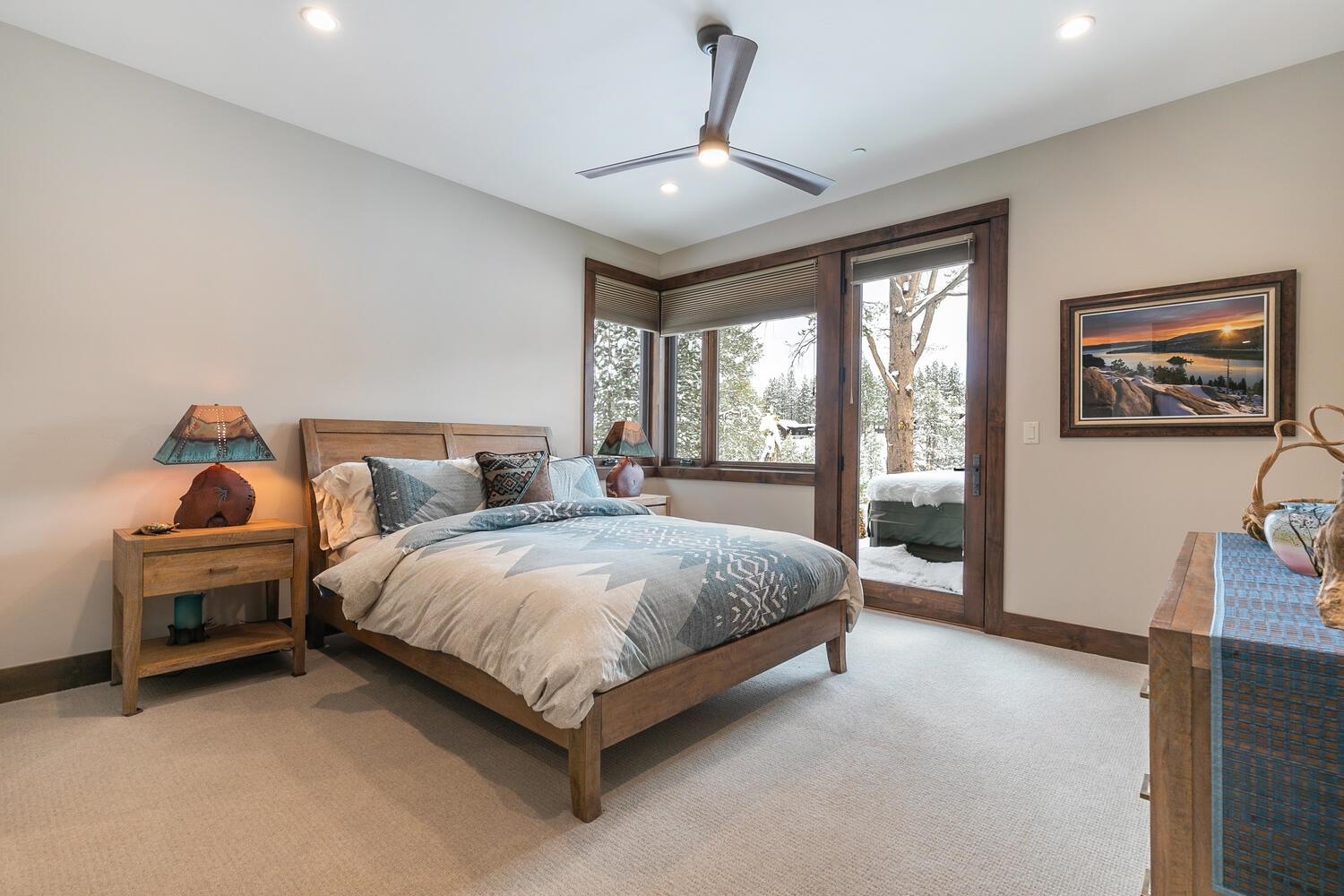 11631 Ghirard Road Truckee, CA 96161 - Photo 15 of 21 a spacious bedroom with a bed and large windows