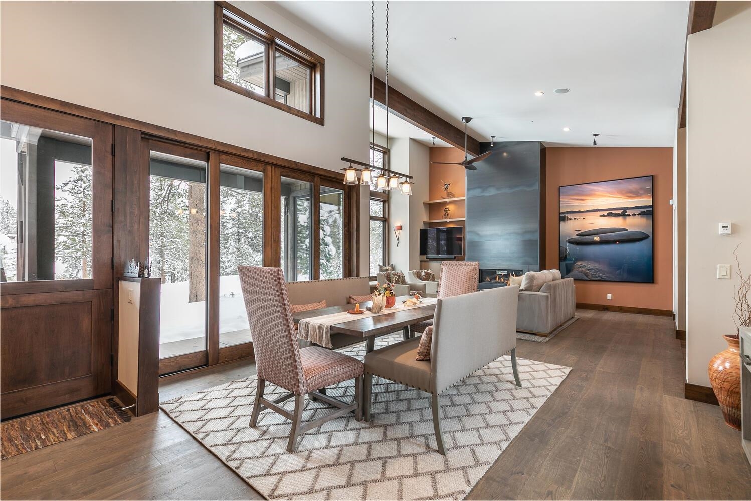 11631 Ghirard Road Truckee, CA 96161 - Photo 4 of 21 a dining room with furniture a chandelier and wooden floor