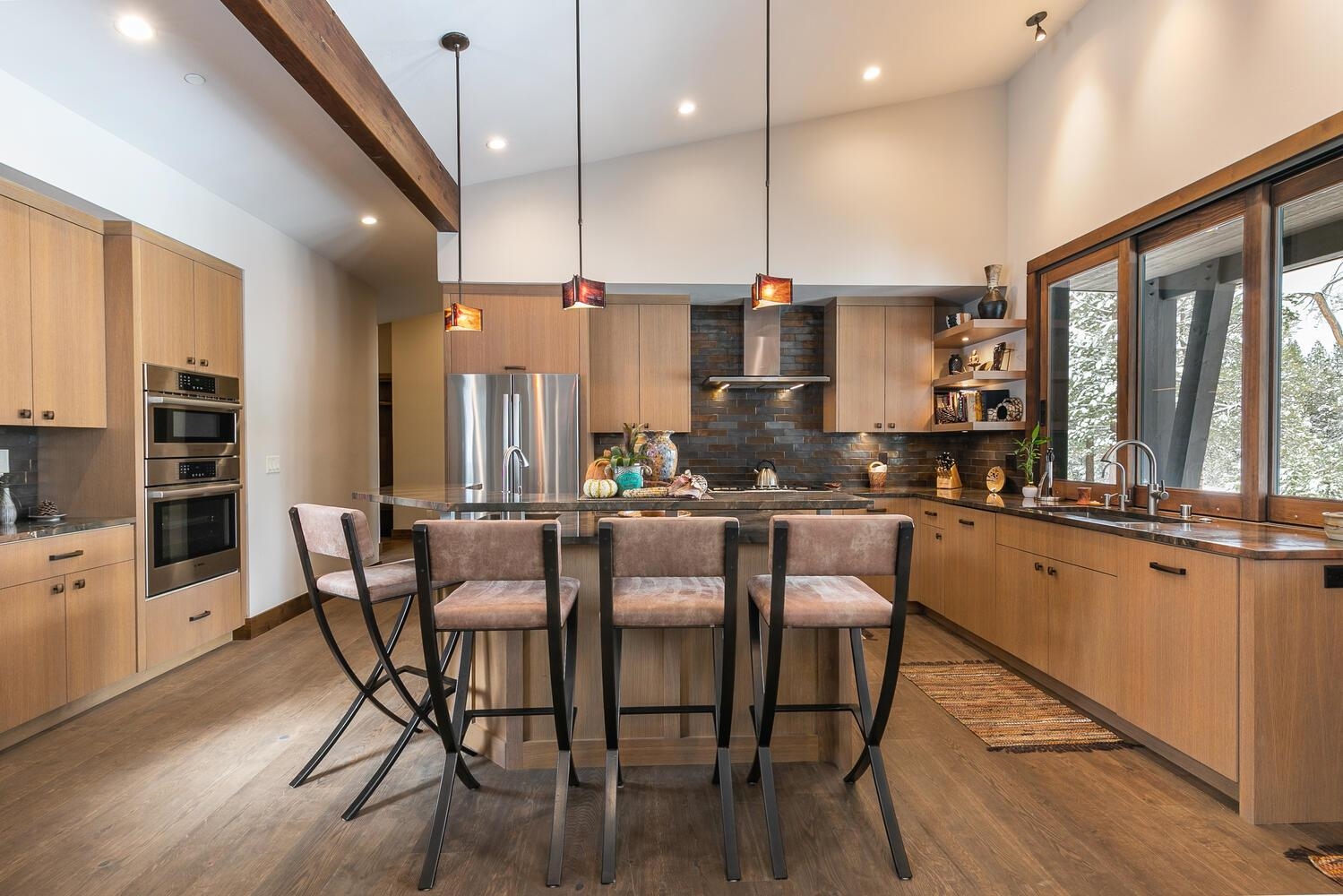 11631 Ghirard Road Truckee, CA 96161 - Photo 6 of 21 a large kitchen with a table and chairs