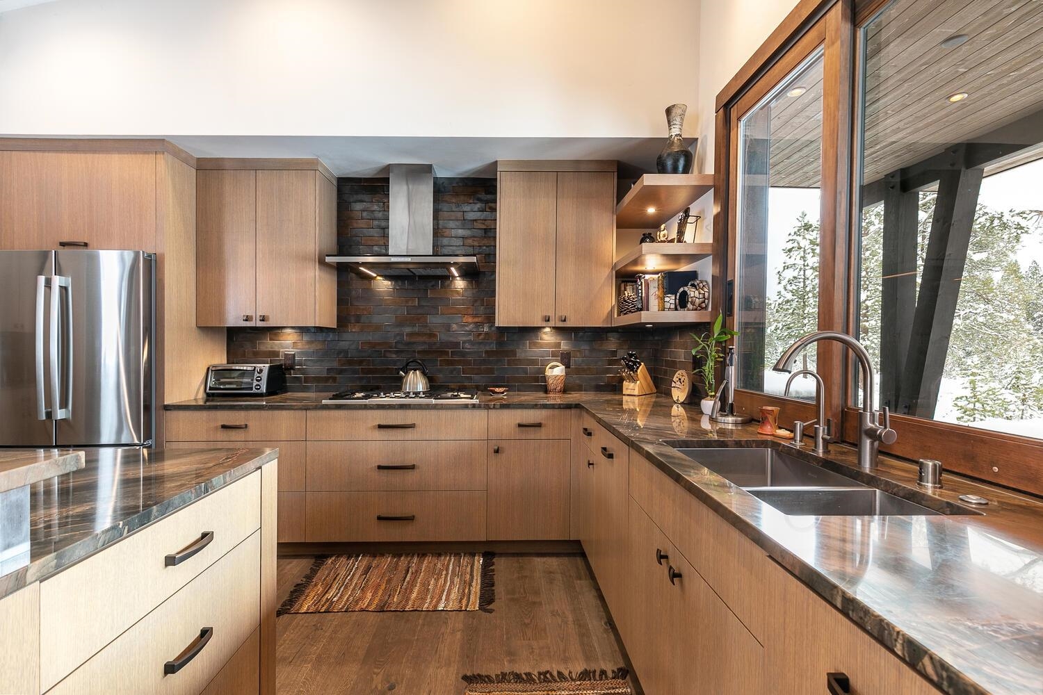 11631 Ghirard Road Truckee, CA 96161 - Photo 10 of 21 a kitchen with stainless steel appliances granite countertop a sink and a stove
