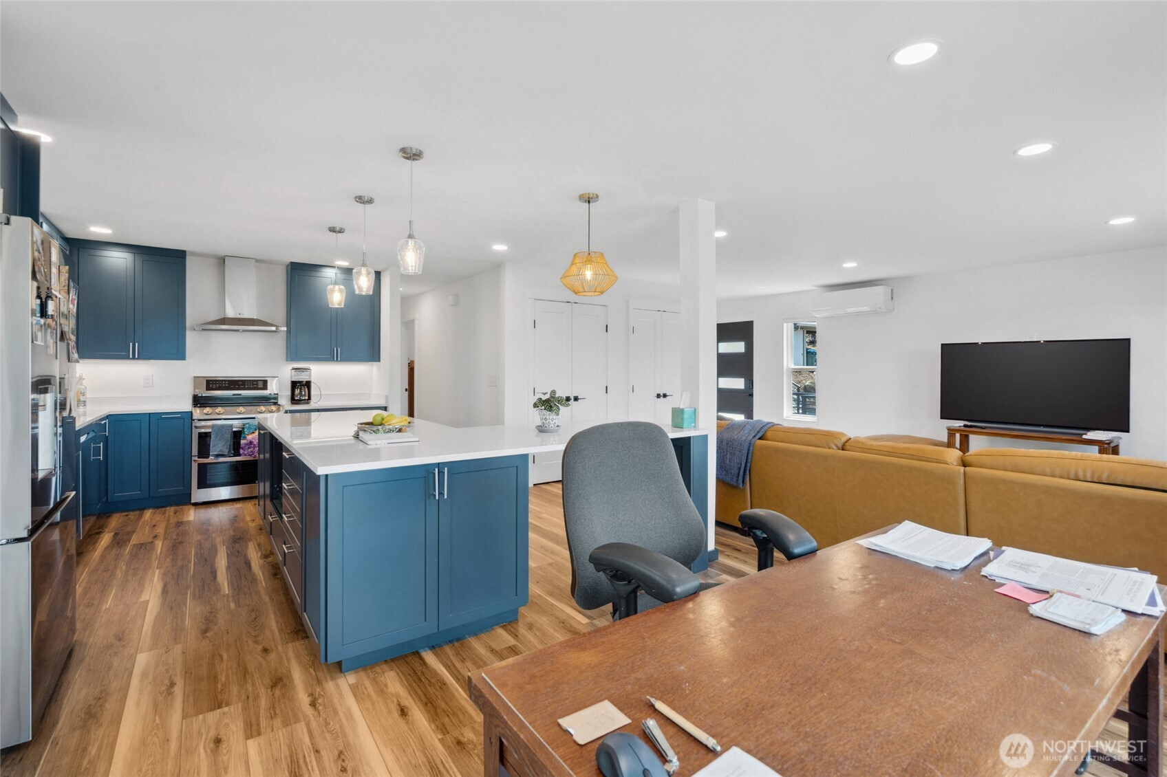 201 South State Street, Unit A Bellingham, WA 98225 - Photo 11 of 35 a living room with furniture and a flat screen tv