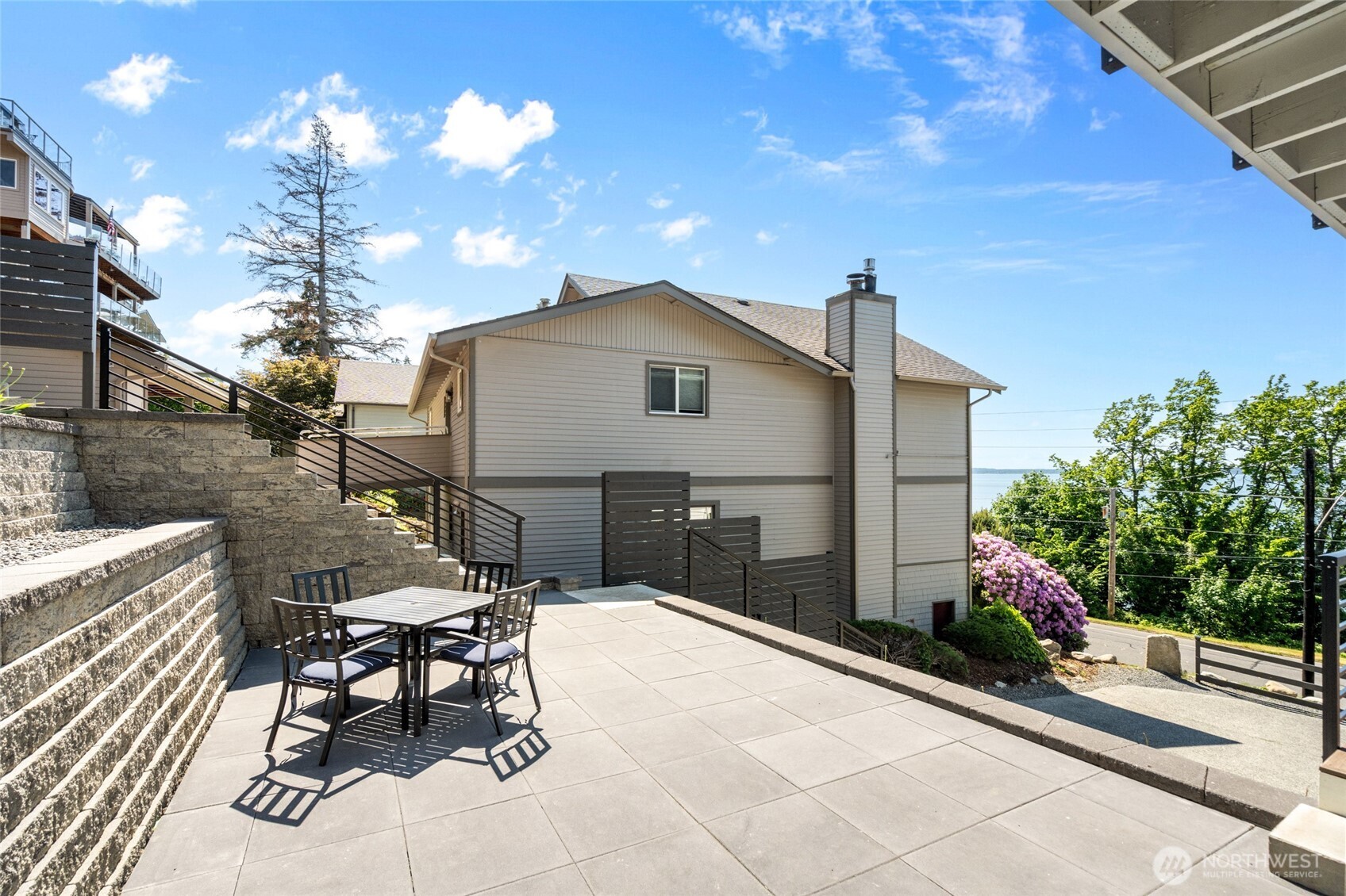 201 South State Street, Unit A Bellingham, WA 98225 - Photo 20 of 35 a roof deck with table and chairs and potted plants