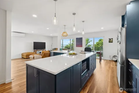 a kitchen with counter and chairs