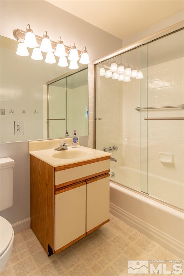 1415 Samuel Way Reno, NV 89509 - Photo 14 of 25 a bathroom with a sink double vanity and a mirror
