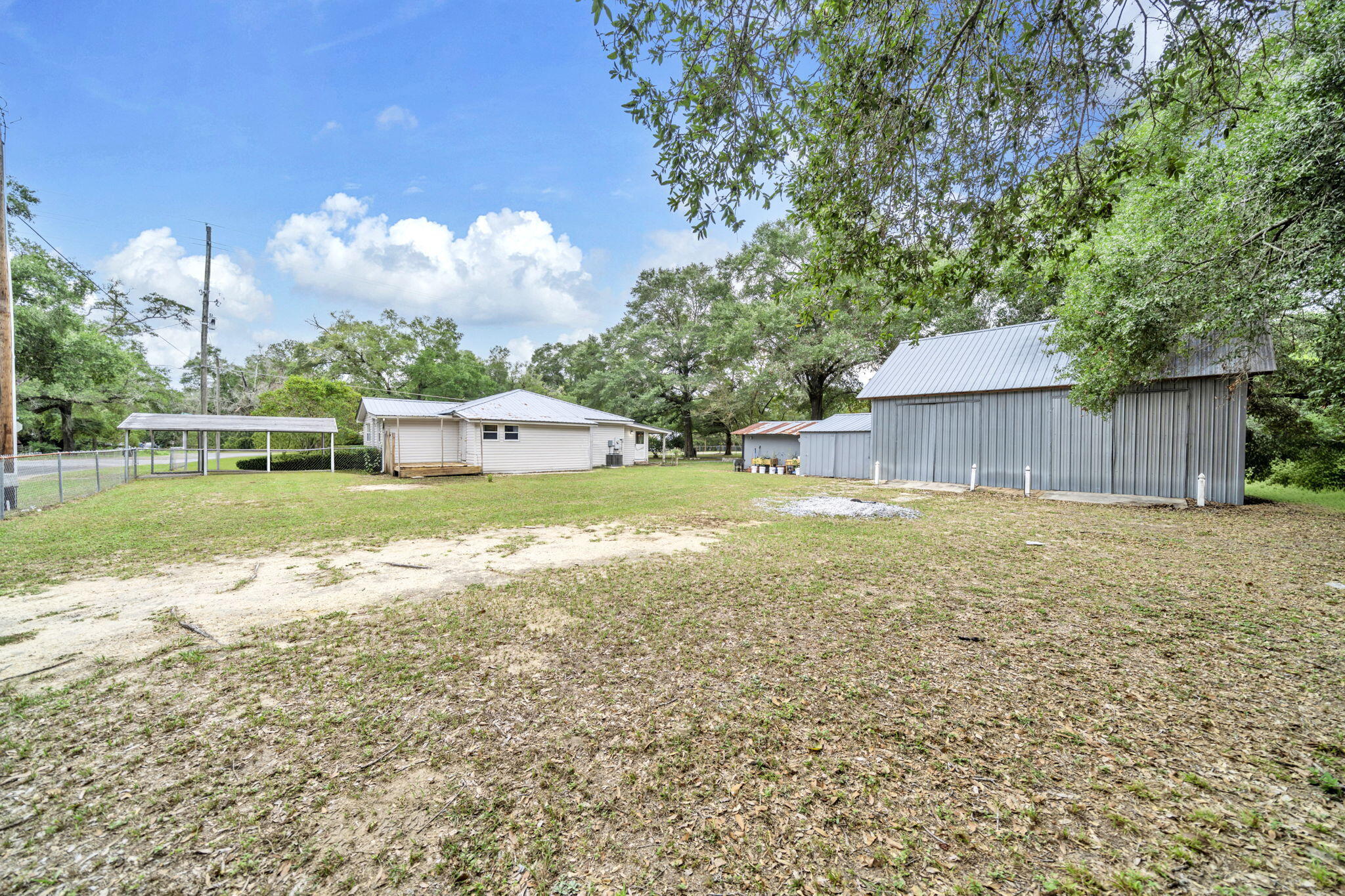 226 South 19th Street DeFuniak Springs, FL 32435 - Photo 12 of 46 a view of a house with a yard and sitting area
