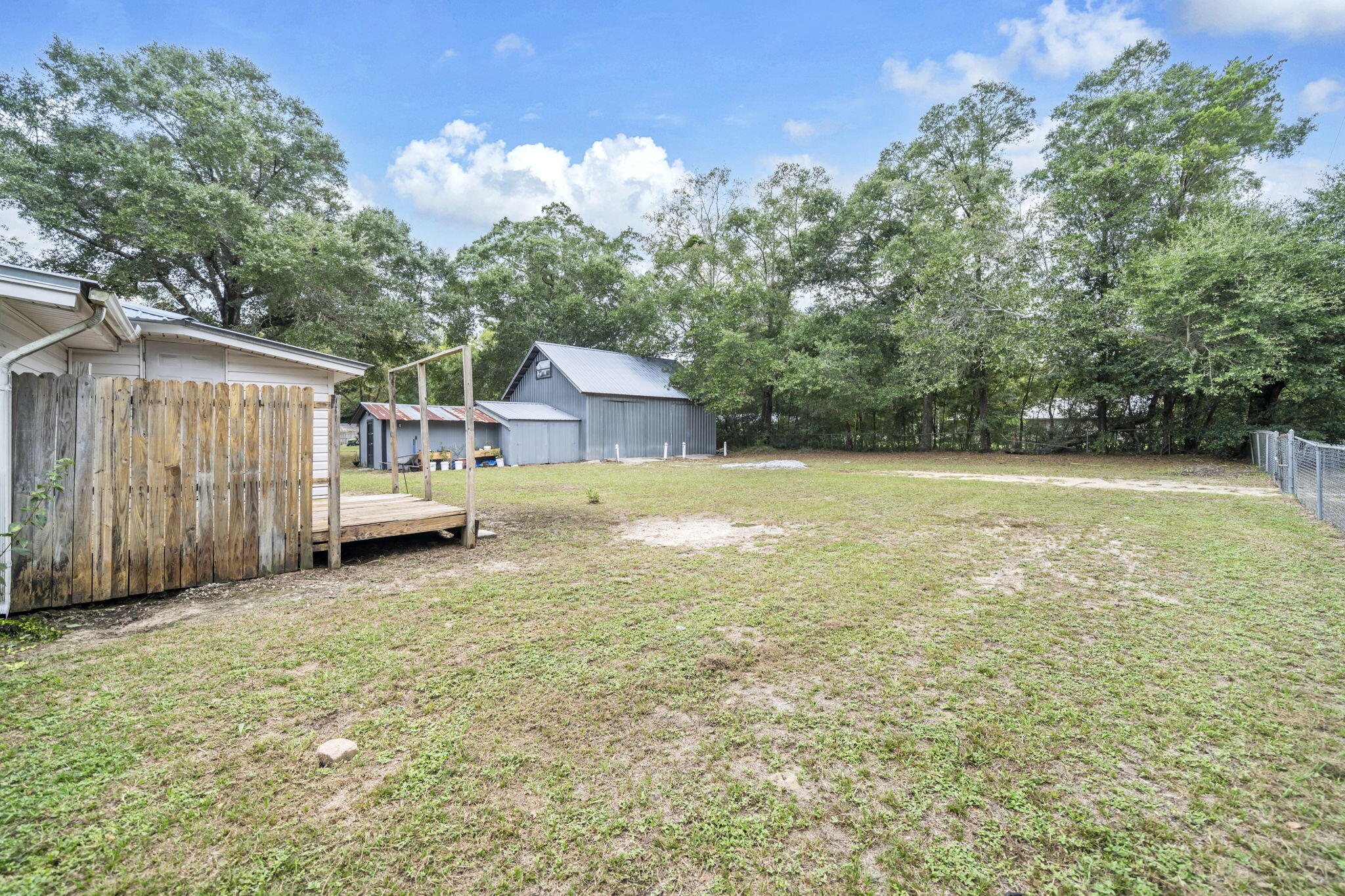 226 South 19th Street DeFuniak Springs, FL 32435 - Photo 13 of 46 a view of a house with backyard and tree