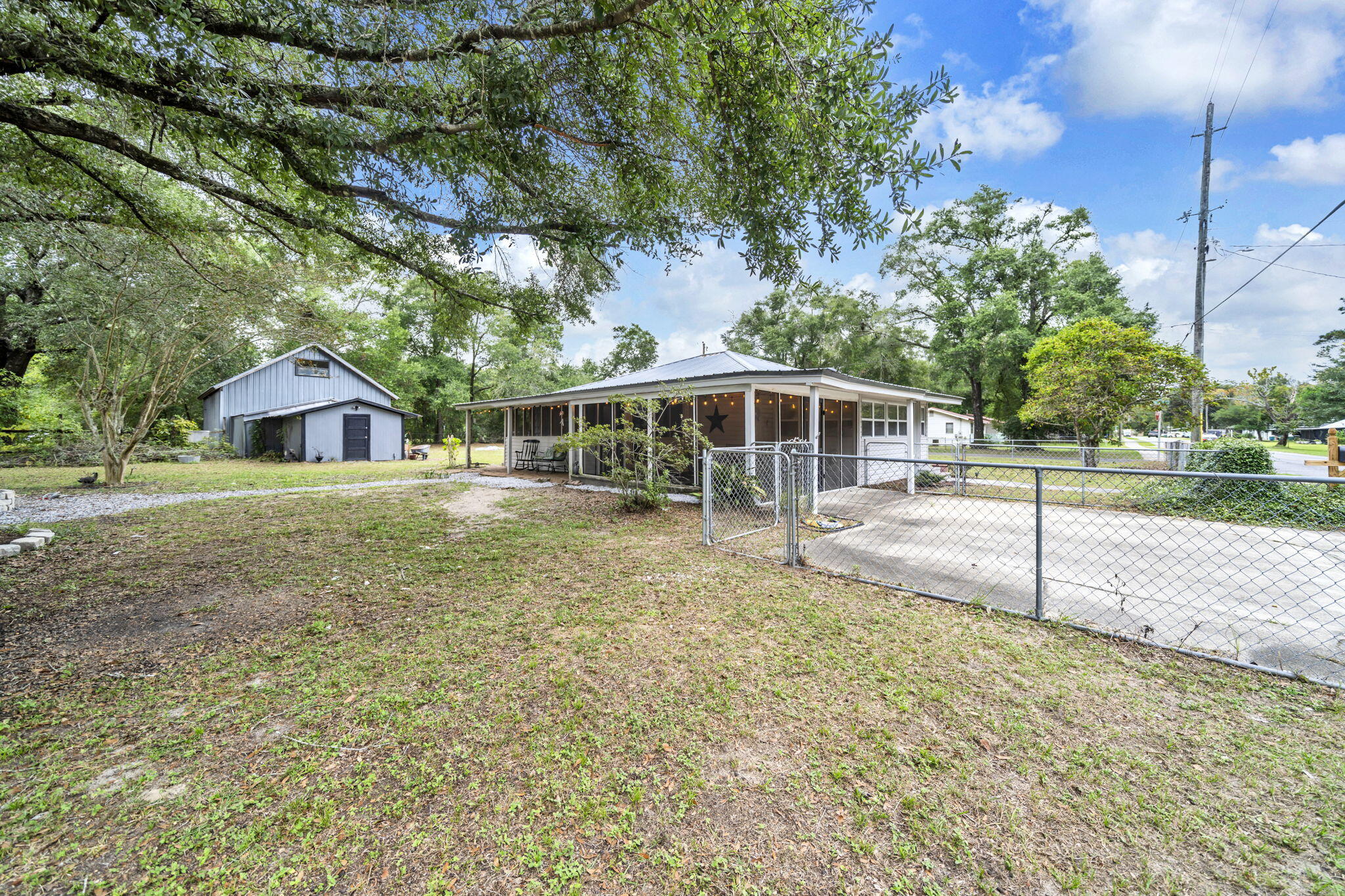 226 South 19th Street DeFuniak Springs, FL 32435 - Photo 18 of 46 a house view with a garden space
