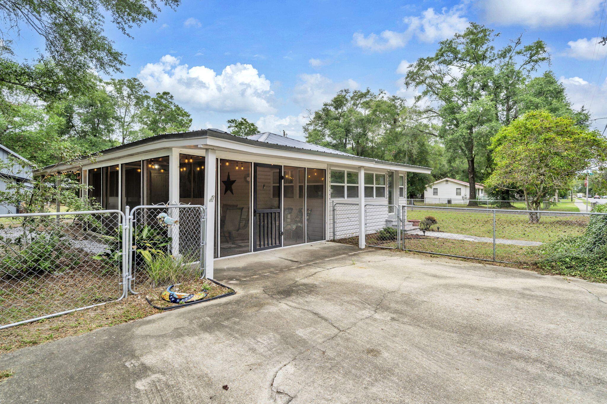 226 South 19th Street DeFuniak Springs, FL 32435 - Photo 19 of 46 a view of a house with backyard porch and garden