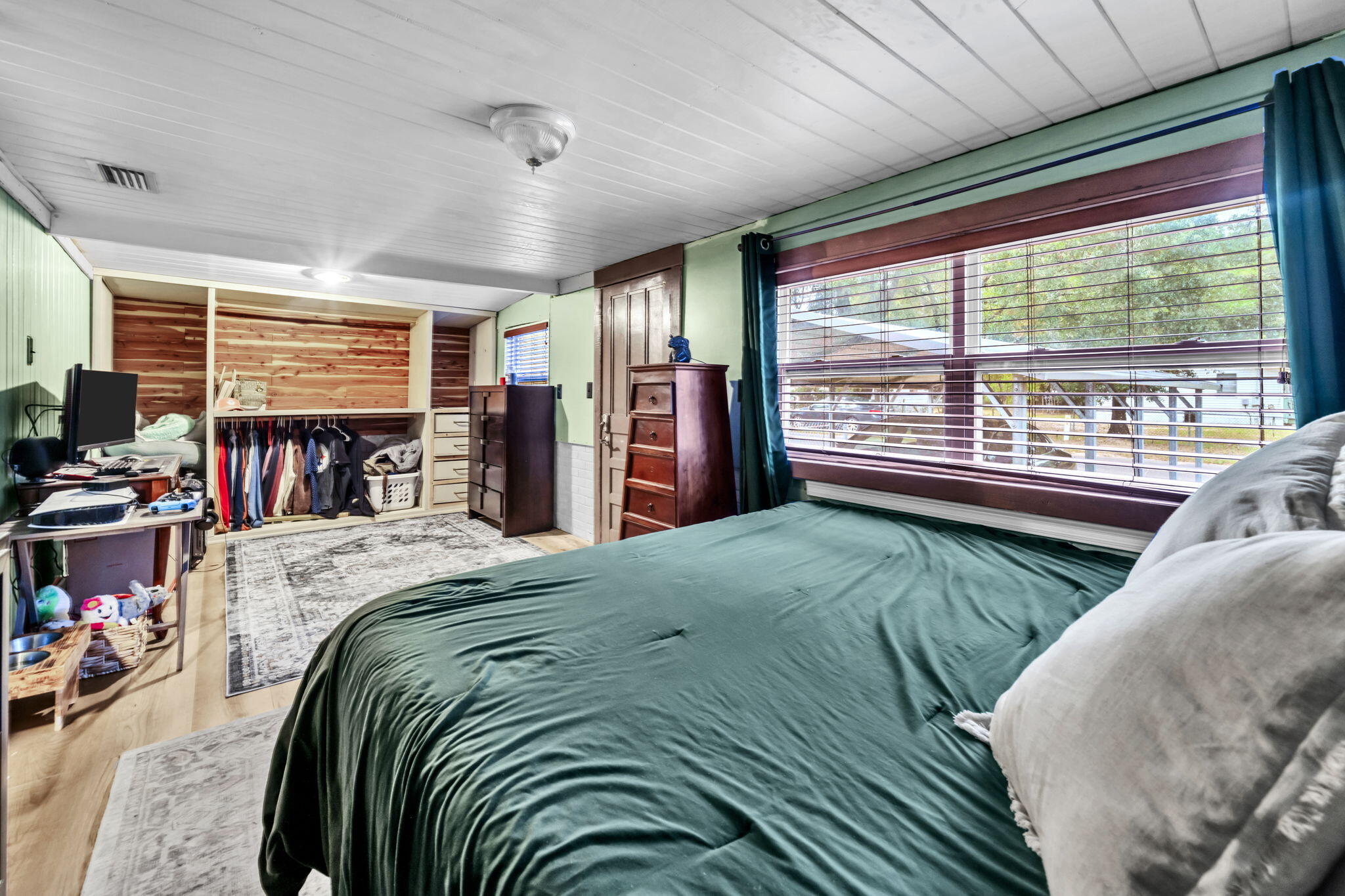 226 South 19th Street DeFuniak Springs, FL 32435 - Photo 25 of 46 a bed sitting in a bedroom next to a window