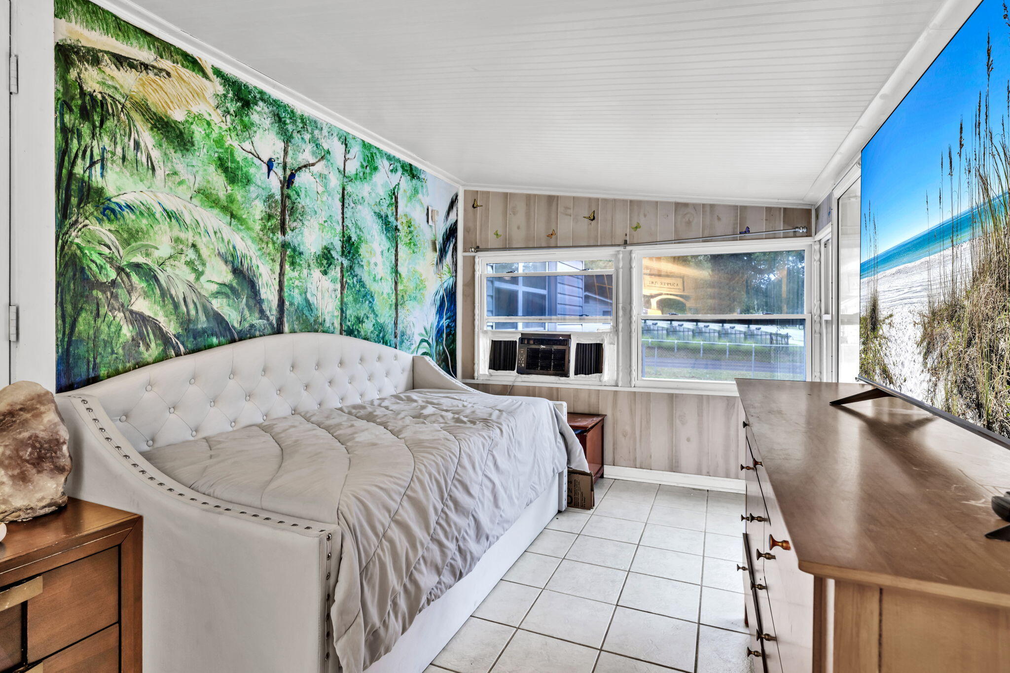 226 South 19th Street DeFuniak Springs, FL 32435 - Photo 27 of 46 a bed sitting in a spacious bedroom next to a window