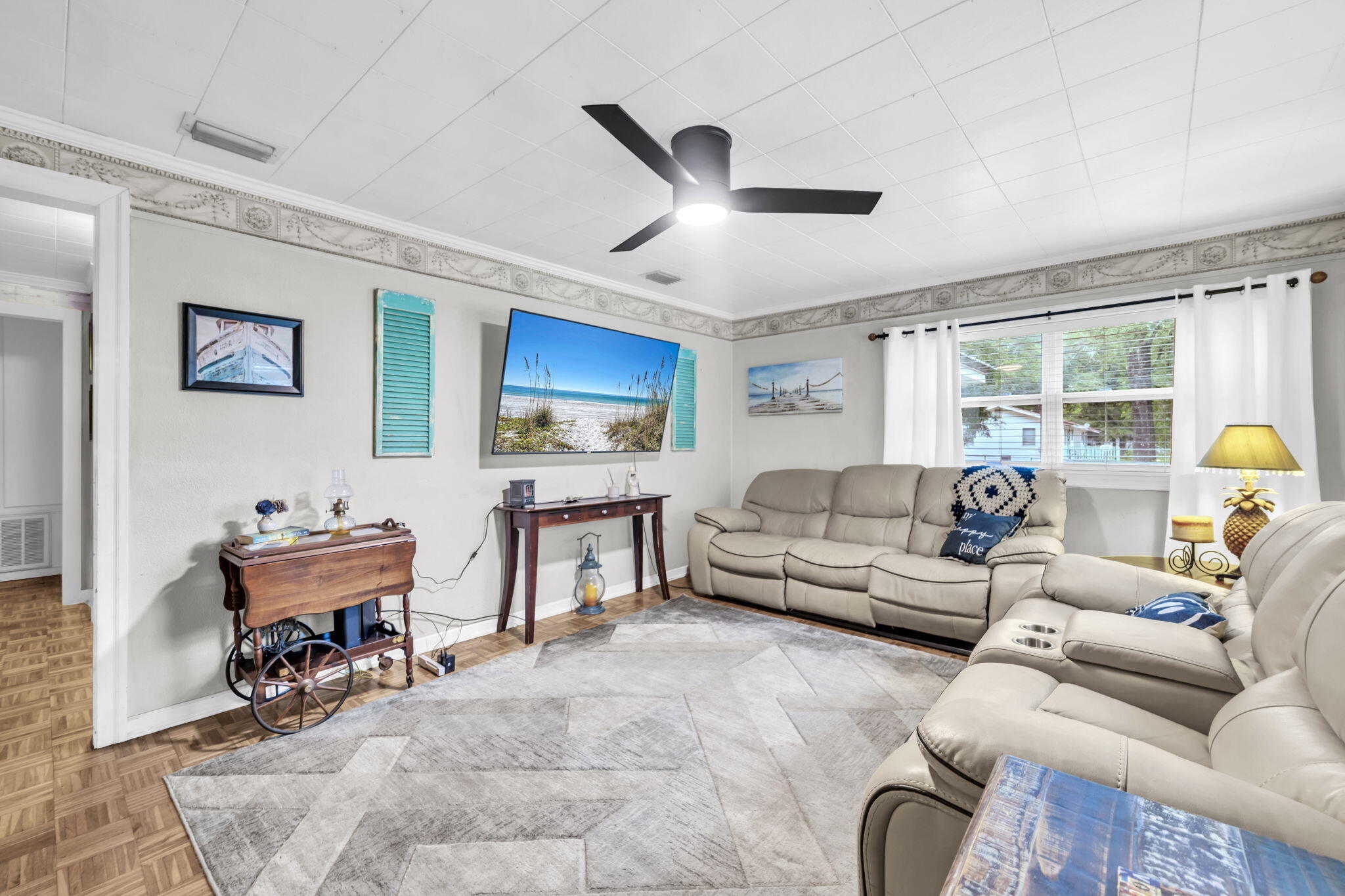 226 South 19th Street DeFuniak Springs, FL 32435 - Photo 33 of 46 a living room with furniture and a flat screen tv