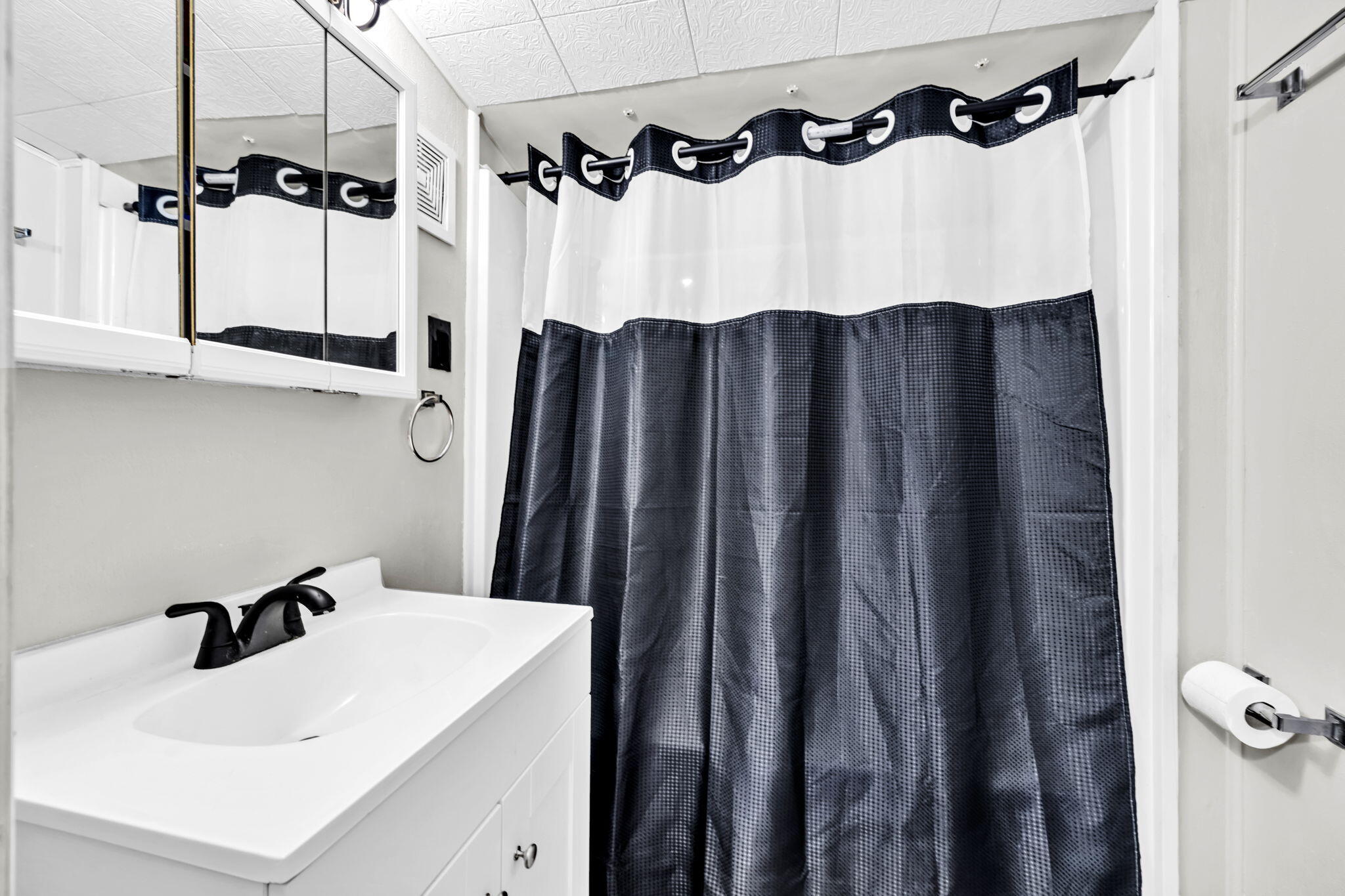 226 South 19th Street DeFuniak Springs, FL 32435 - Photo 37 of 46 a bathroom with a sink vanity and a mirror