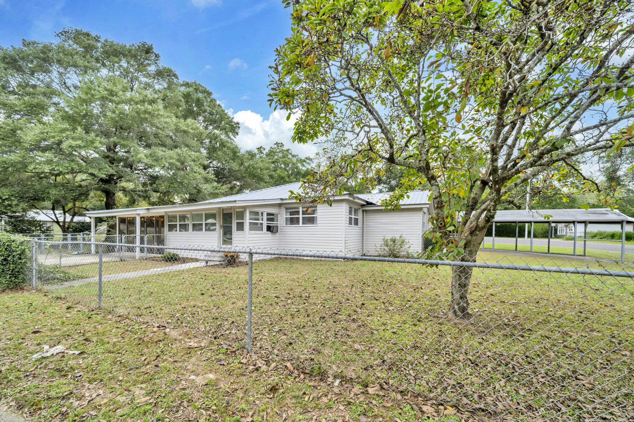 226 South 19th Street DeFuniak Springs, FL 32435 - Photo 5 of 46 front view of a house with a yard