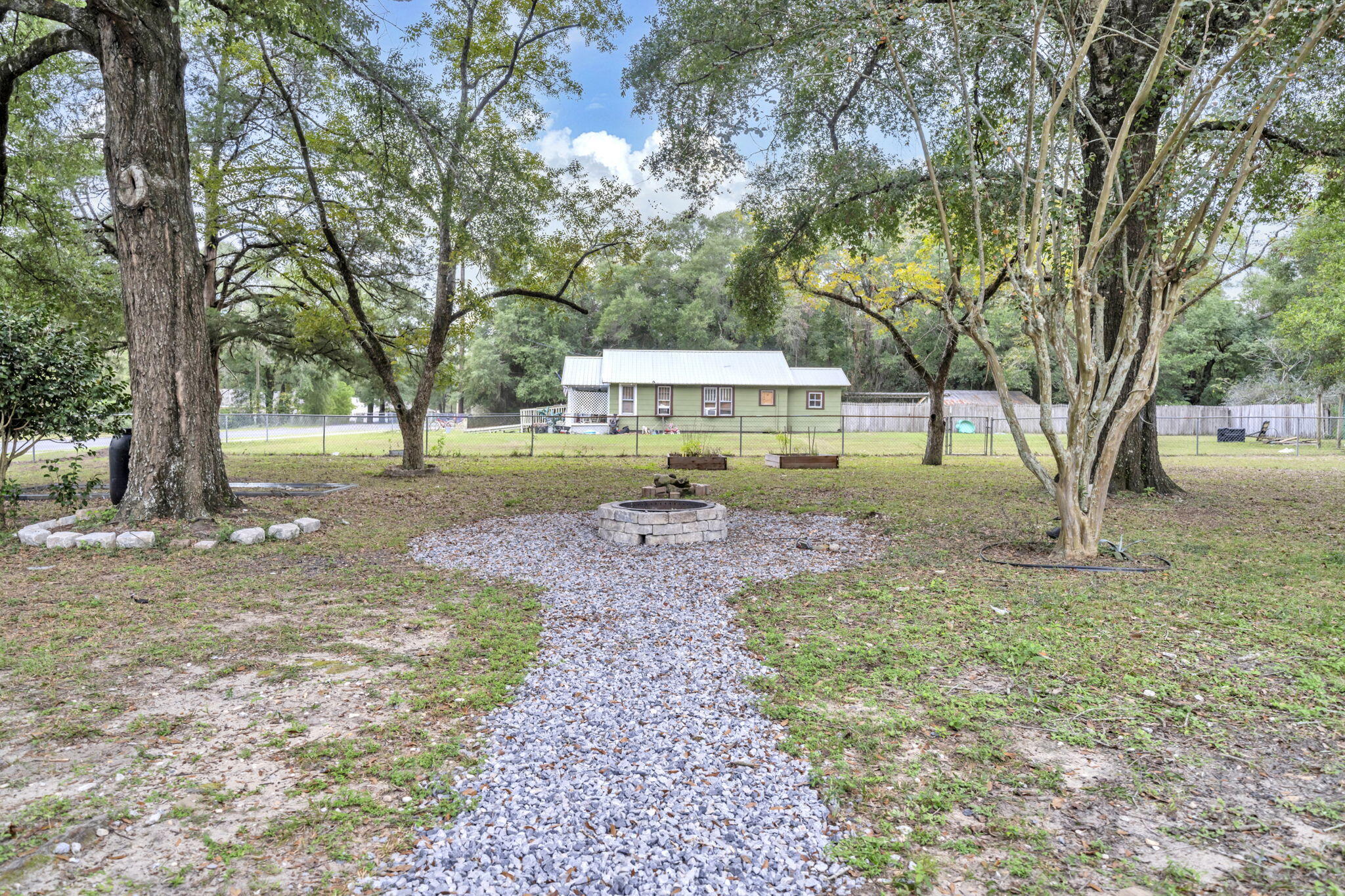 226 South 19th Street DeFuniak Springs, FL 32435 - Photo 9 of 46 a view of a yard with tree s