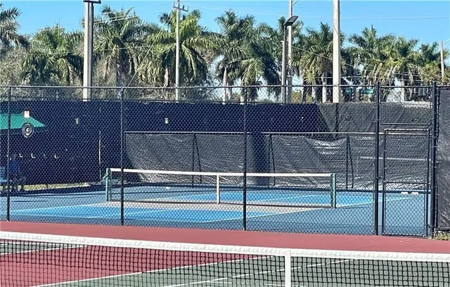 a view of an outdoor space and tennis court