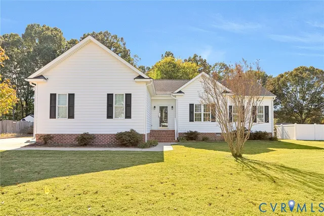 a view of a house with swimming pool and yard