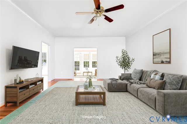 a living room with furniture and a flat screen tv