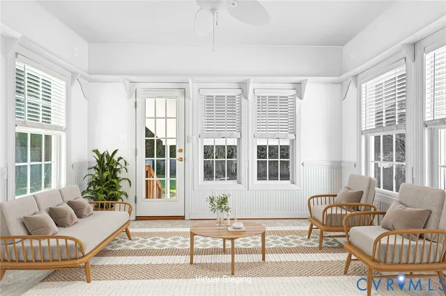 a living room with furniture and a window