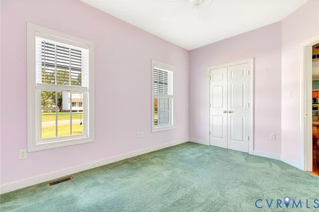 a view of an empty room with windows