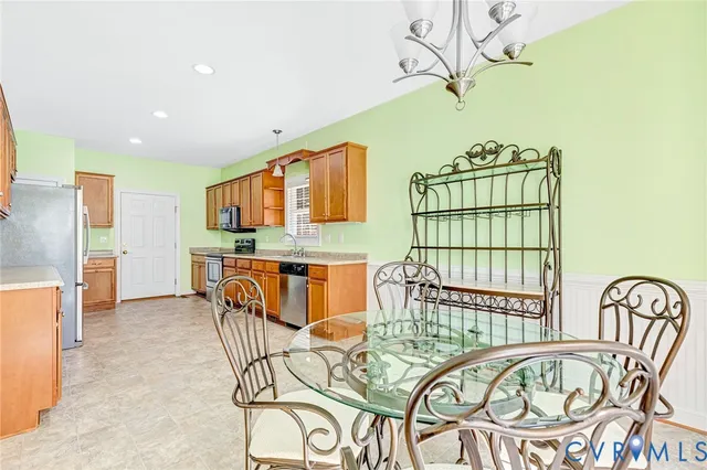 a dining room with furniture and wooden floor