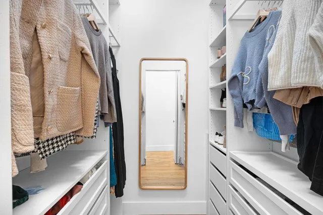 a kitchen with stainless steel appliances granite countertop a refrigerator and a stove